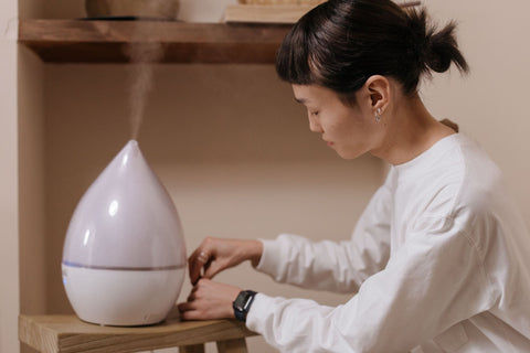 Woman using a diffuser