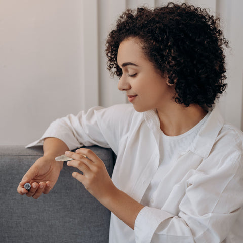 Woman applying essential oil